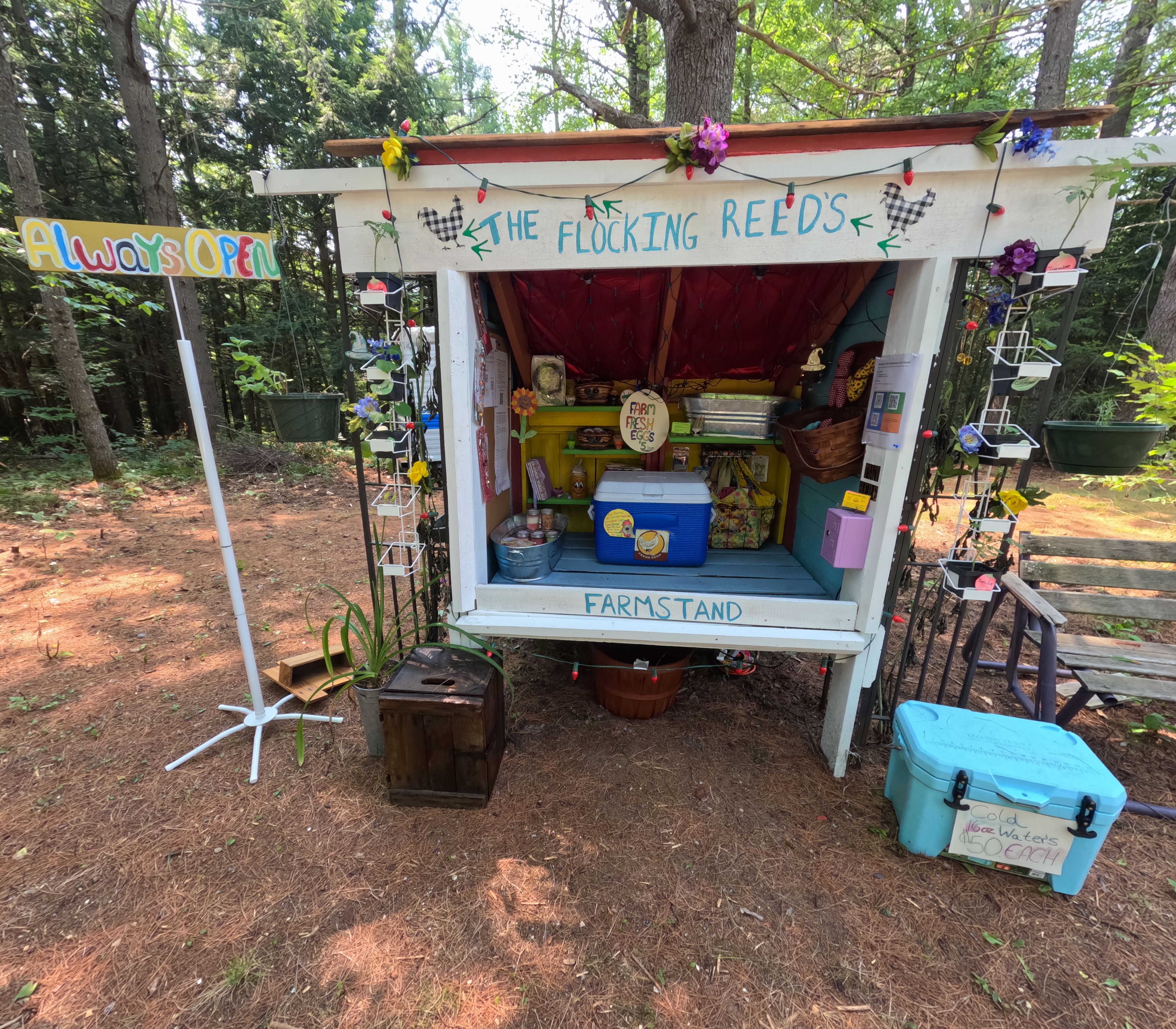 Farm Stand with a sign and cooler